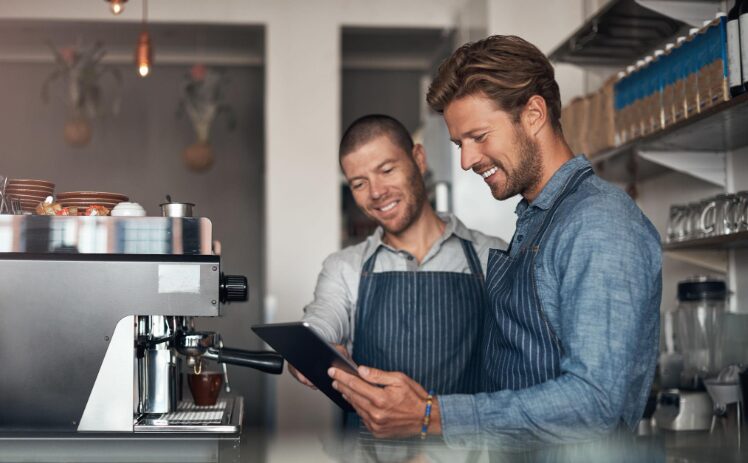 2 employees working at a cafe
