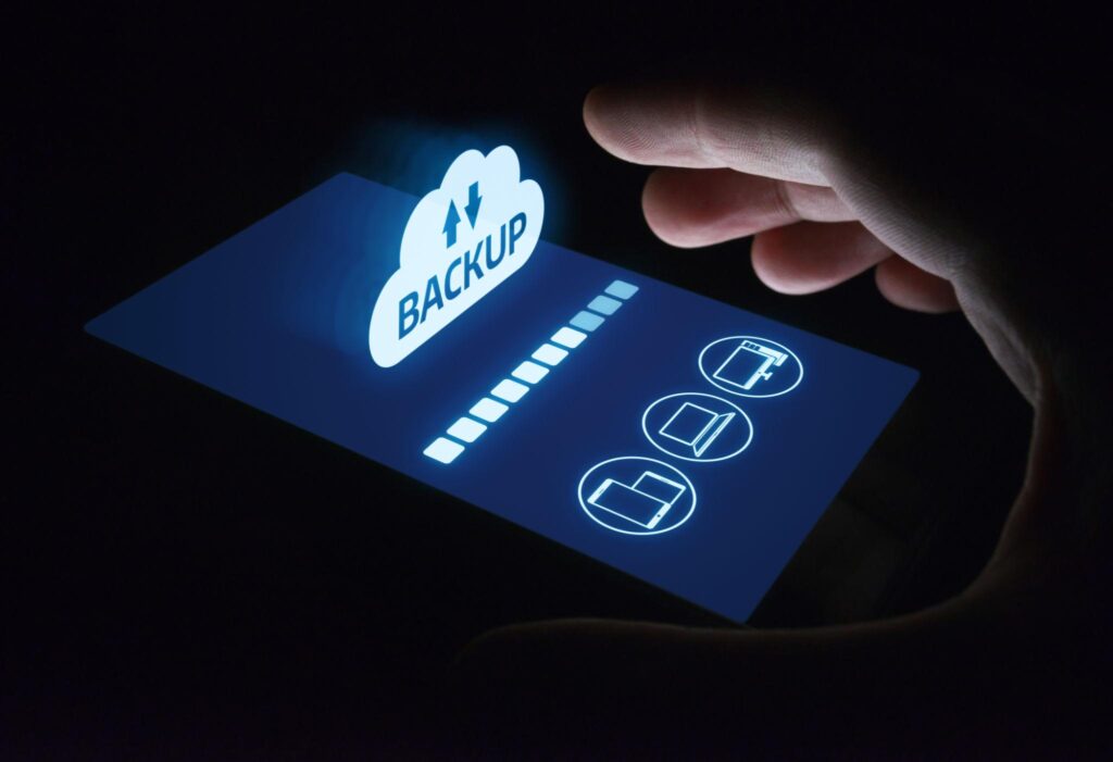 Person backing up data on their phone