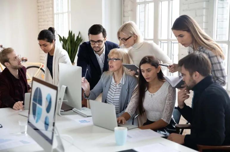 group of employees gathering for a meeting