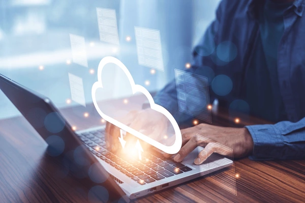 Man using Cloud Technology on laptop