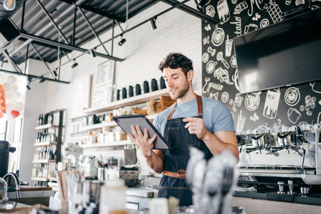 Barista looking at a tablet