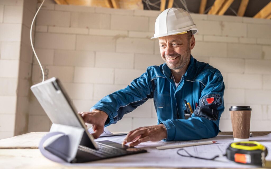 Construction worker using computer