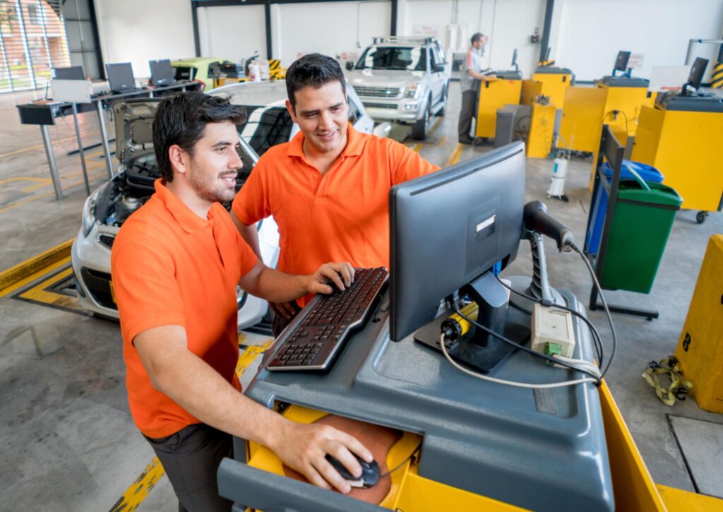 2 mechanic stationed at a computer