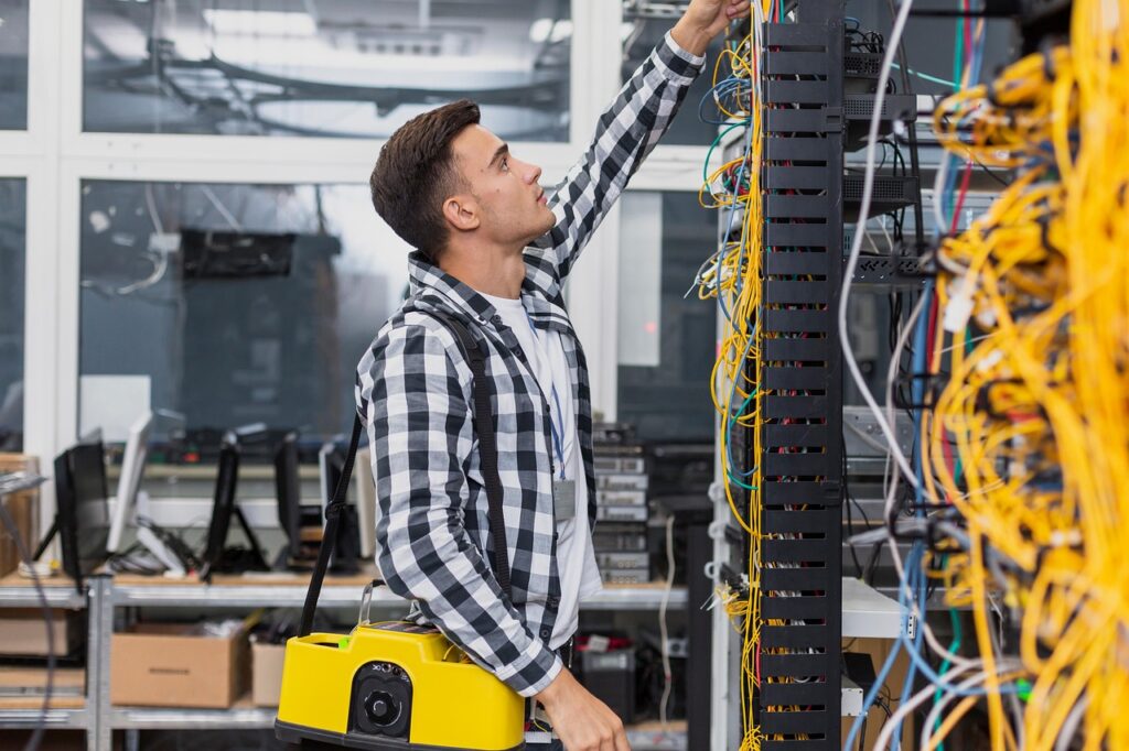 person managing messy cables