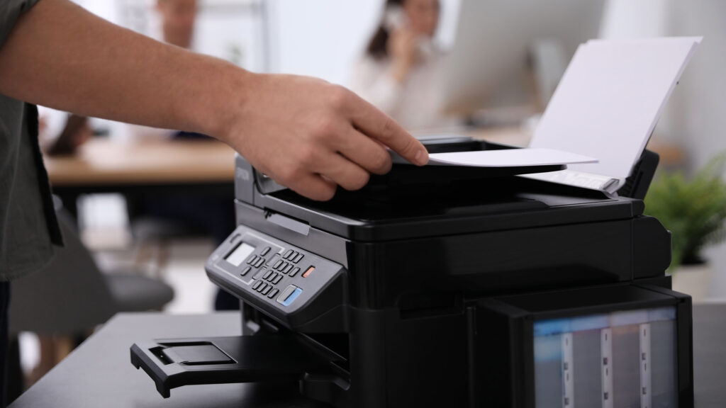 person using a small printer
