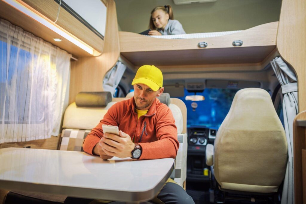 person on their phone in a RV